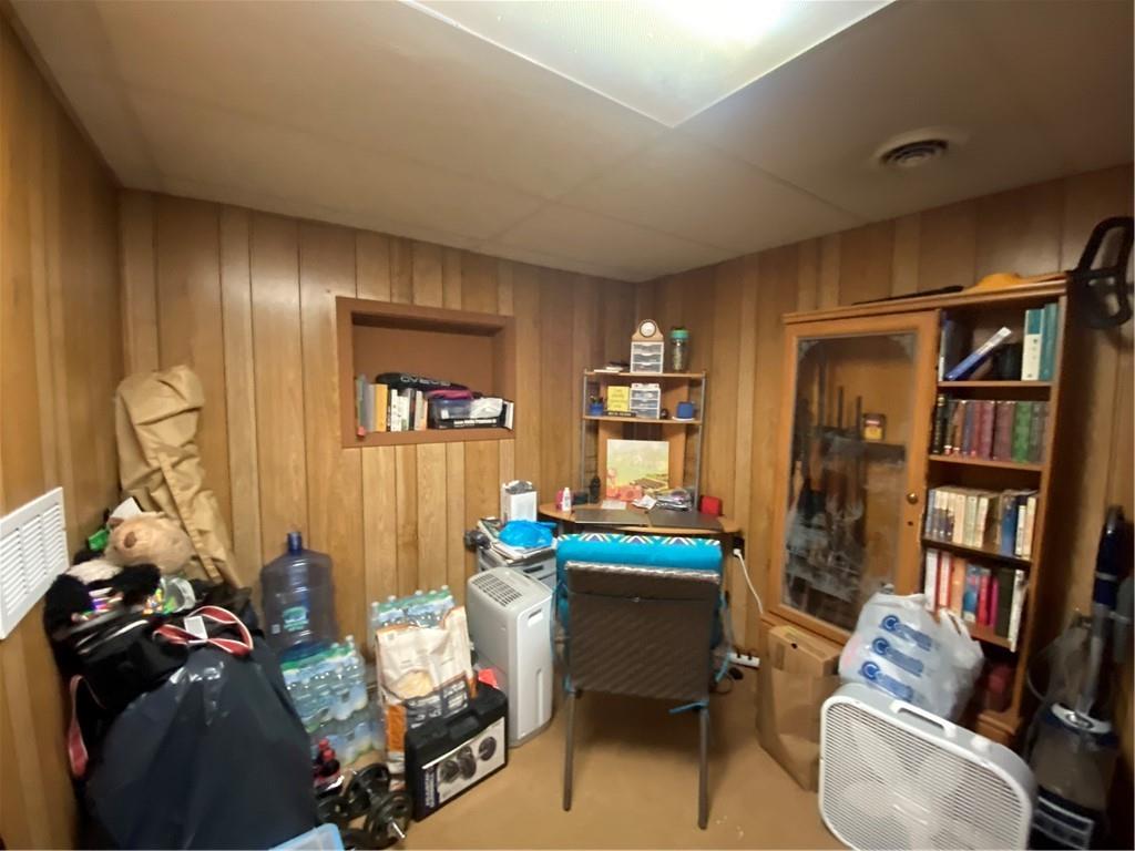 553 Browntown Road New Stanton, PA 15672 - Photo 10 of 20 a room with furniture a bookshelf and a window