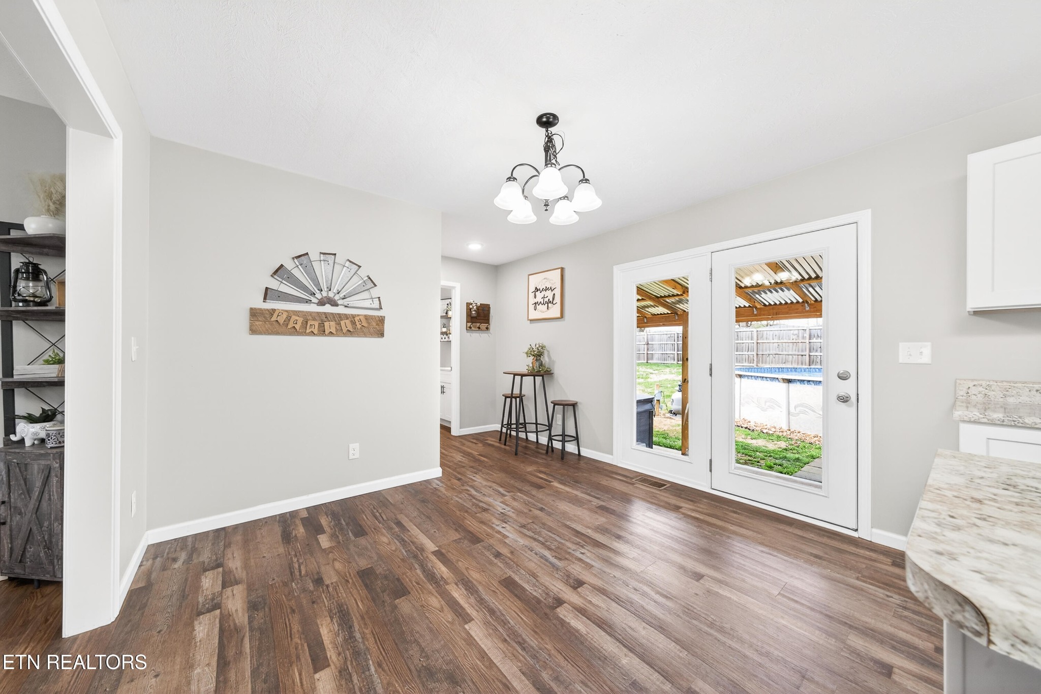 225 Peach Street Baxter, TN 38544 - Photo 12 of 35 wooden floor in an empty room with a window