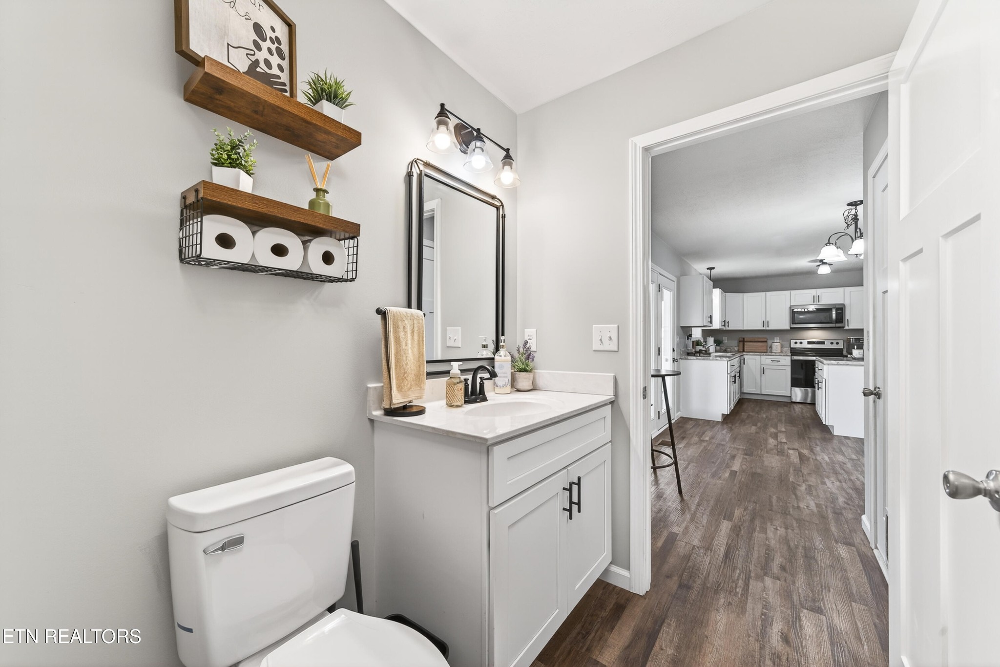 225 Peach Street Baxter, TN 38544 - Photo 15 of 35 a bathroom with a toilet sink and mirror