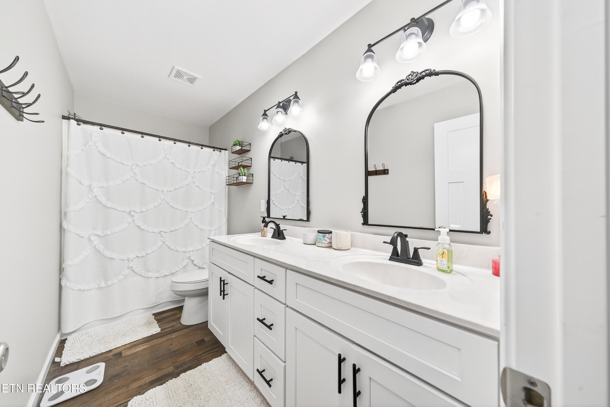 225 Peach Street Baxter, TN 38544 - Photo 19 of 35 a bathroom with a double vanity sink mirror and shower