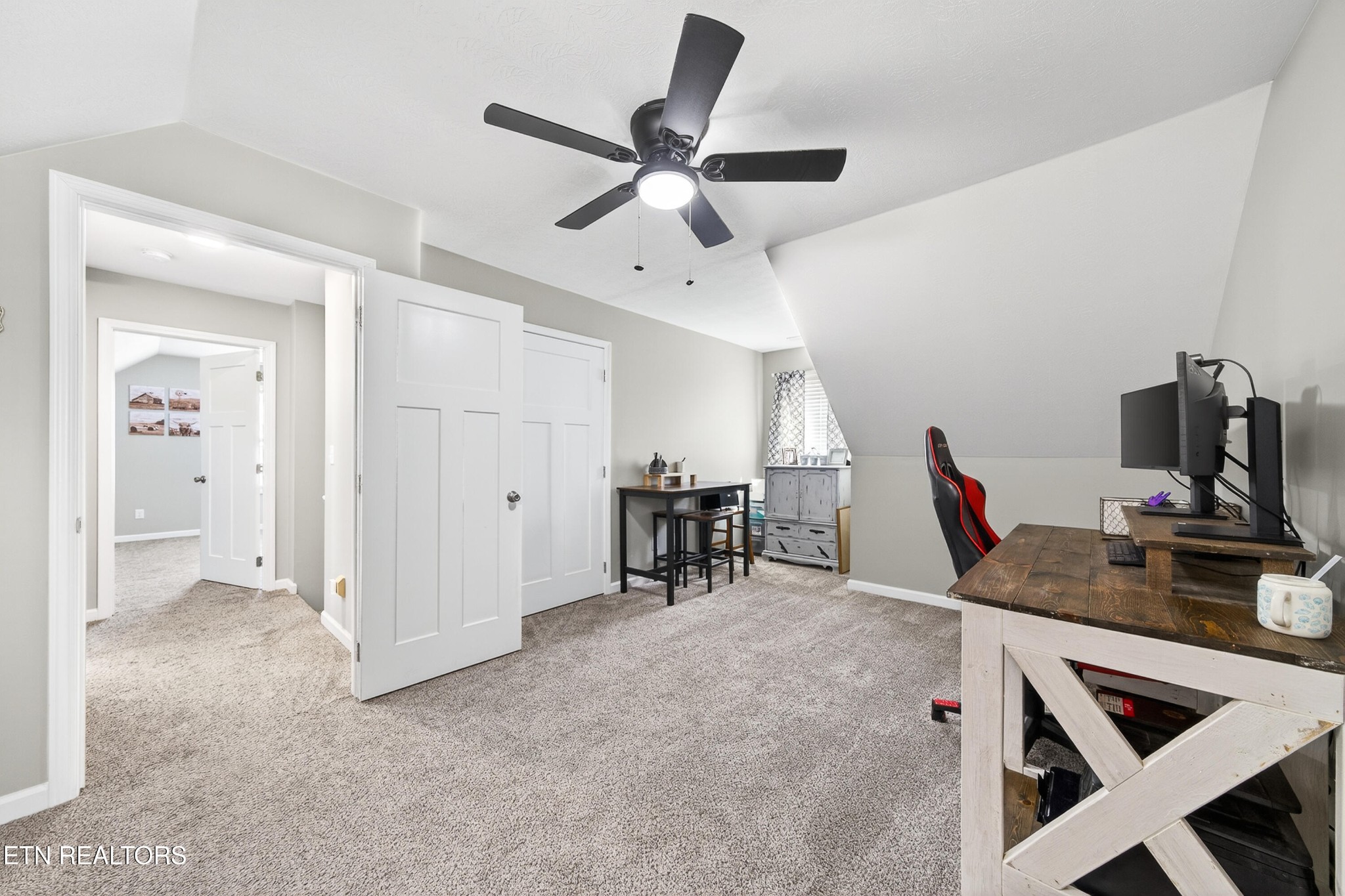 225 Peach Street Baxter, TN 38544 - Photo 23 of 35 a view of a livingroom with furniture and a ceiling fan