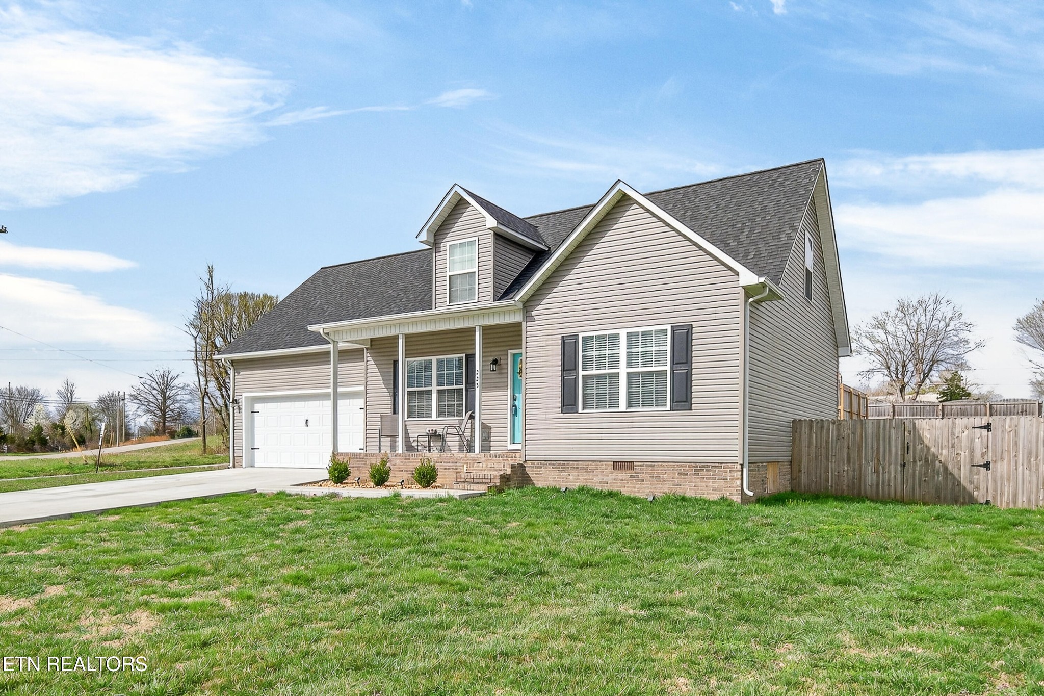 225 Peach Street Baxter, TN 38544 - Photo 28 of 35 a front view of house with yard and green space