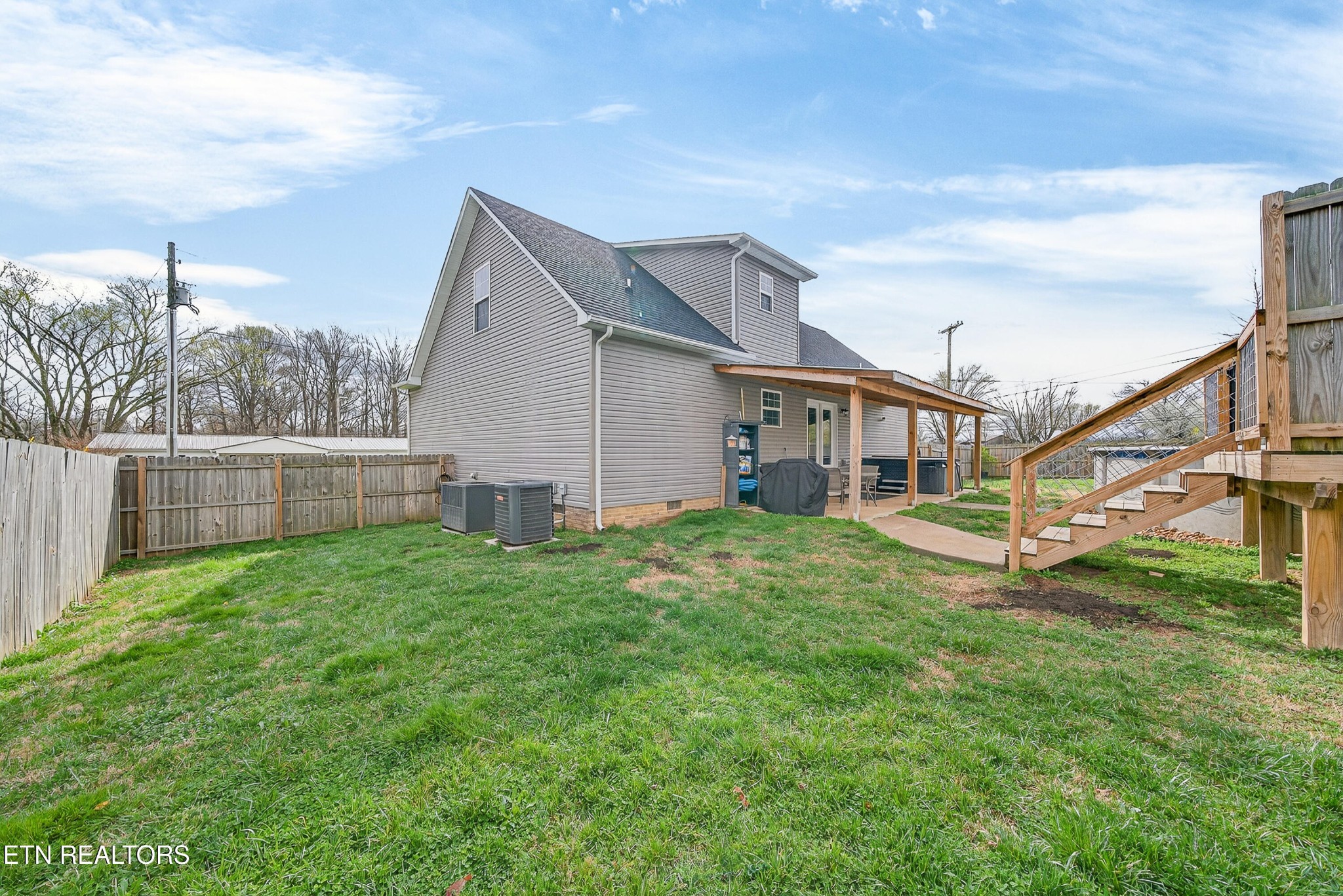 225 Peach Street Baxter, TN 38544 - Photo 30 of 35 a view of a house with a backyard