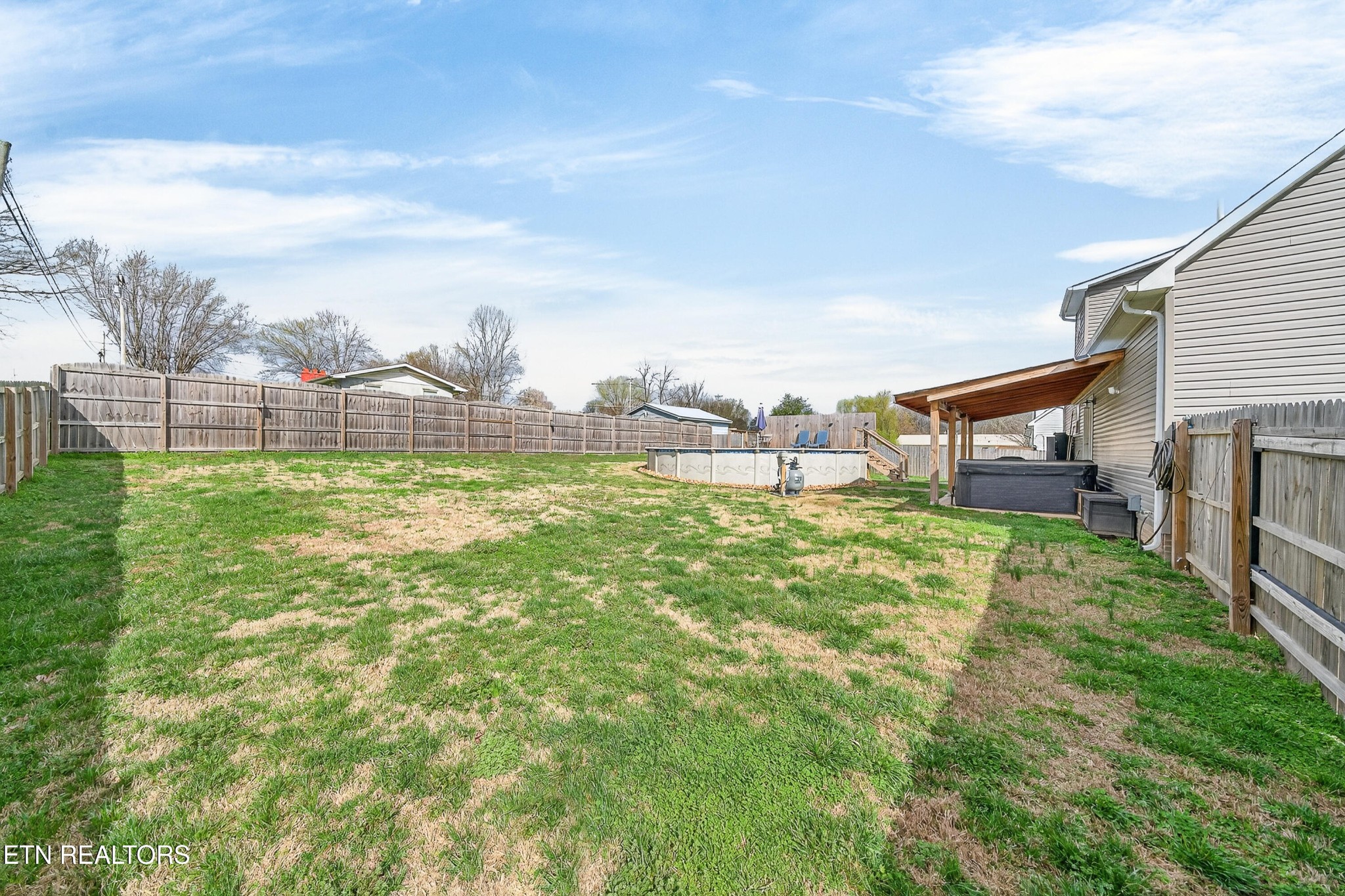 225 Peach Street Baxter, TN 38544 - Photo 4 of 35 a view of a backyard with plants and lake view