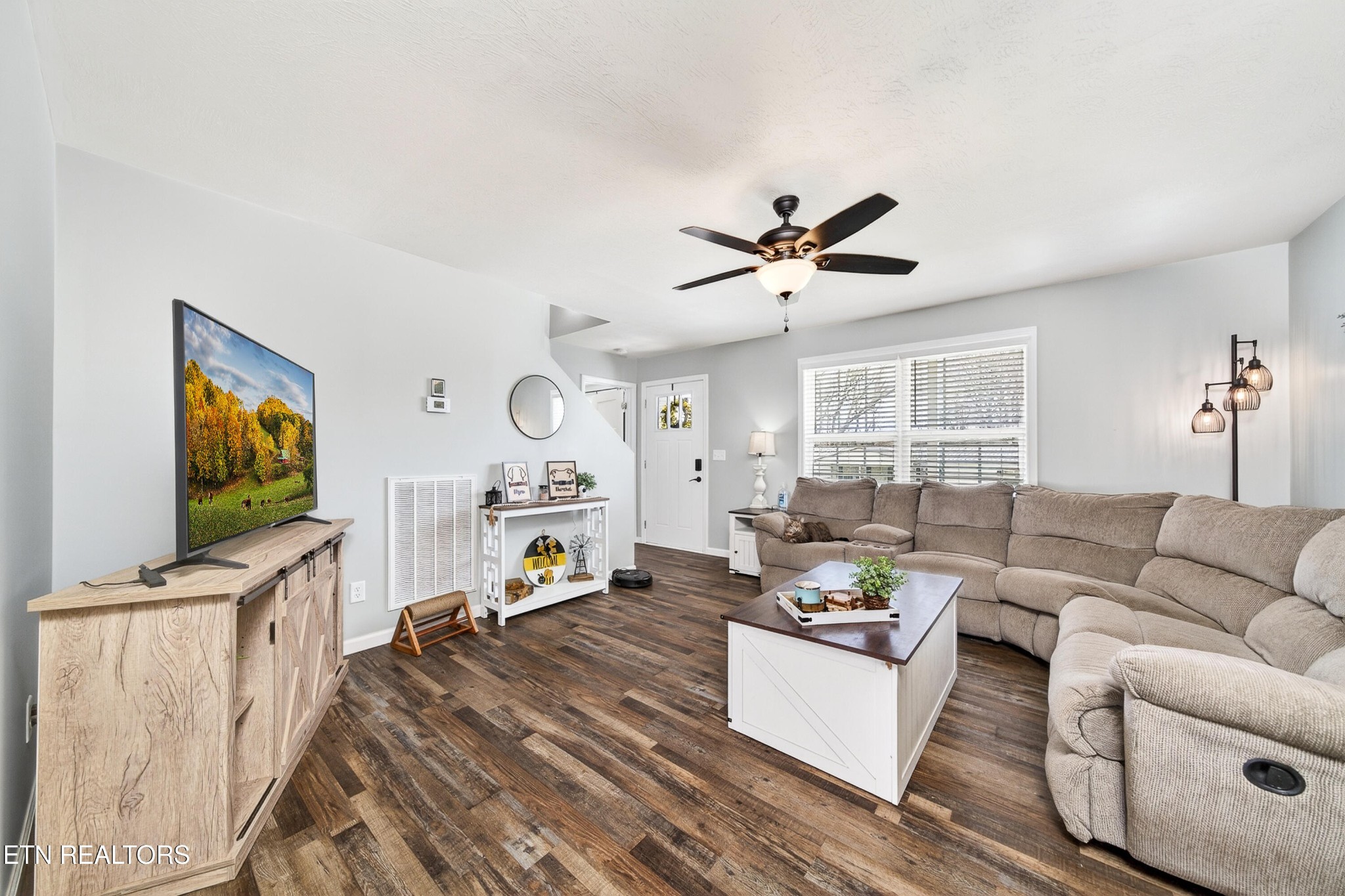 225 Peach Street Baxter, TN 38544 - Photo 6 of 35 a living room with furniture a fireplace and a flat screen tv