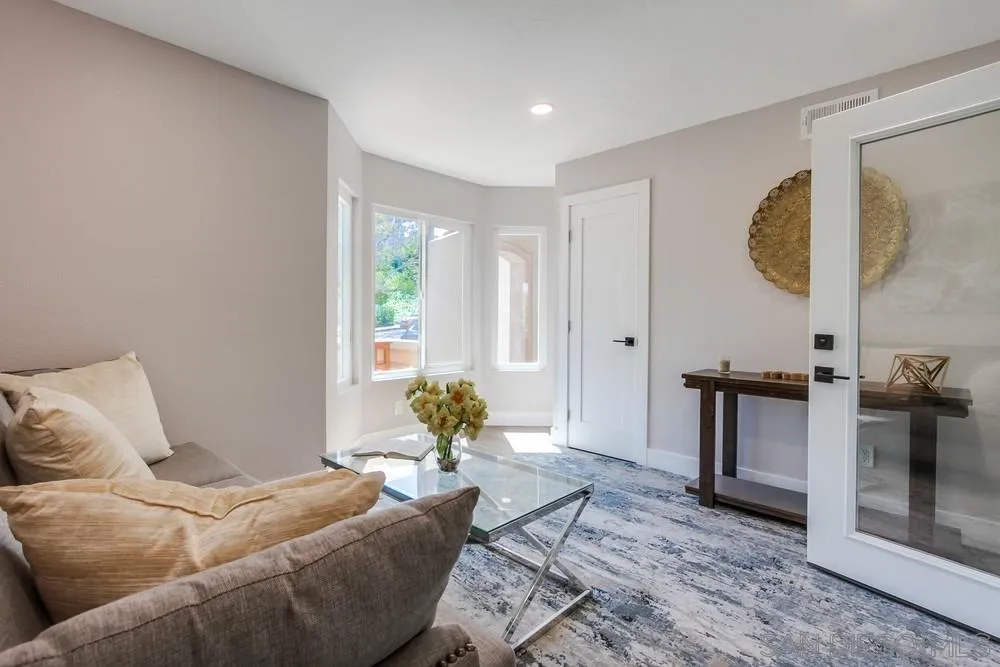 1278 Avenida Miguel Encinitas, CA 92024 - Photo 14 of 47 a living room with furniture a window and a wooden floor
