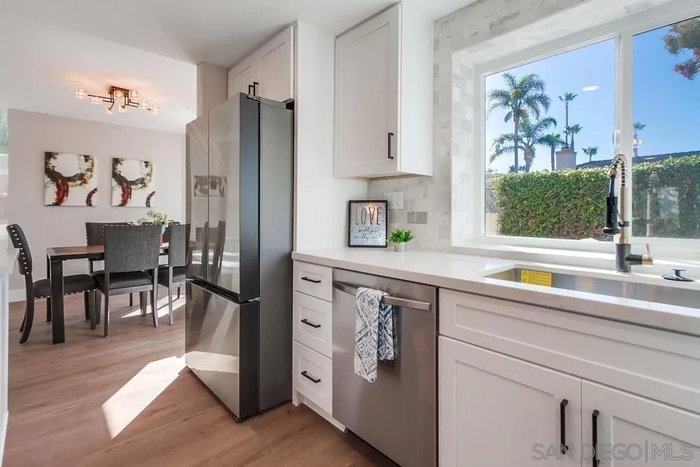 1278 Avenida Miguel Encinitas, CA 92024 - Photo 23 of 47 a kitchen with stainless steel appliances a refrigerator and a sink