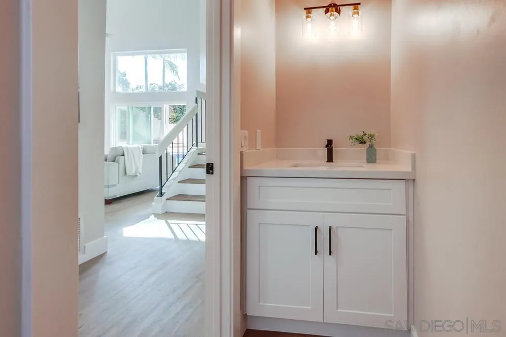 1278 Avenida Miguel Encinitas, CA 92024 - Photo 31 of 47 a view of a hallway with wooden floor and a bathroom