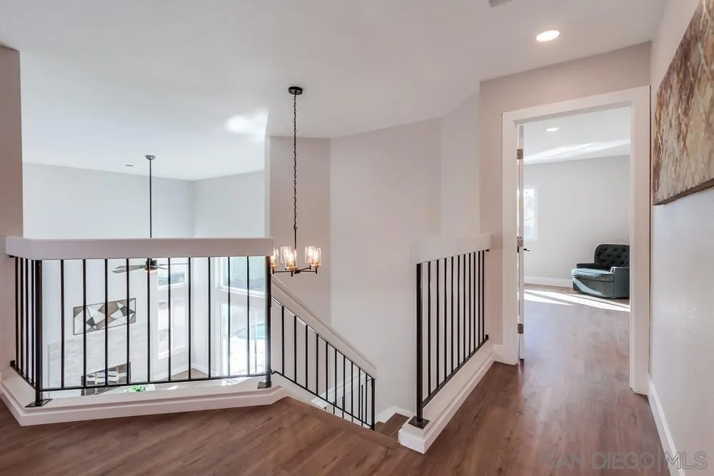 1278 Avenida Miguel Encinitas, CA 92024 - Photo 37 of 47 a view of a hallway with a bedroom and wooden floor