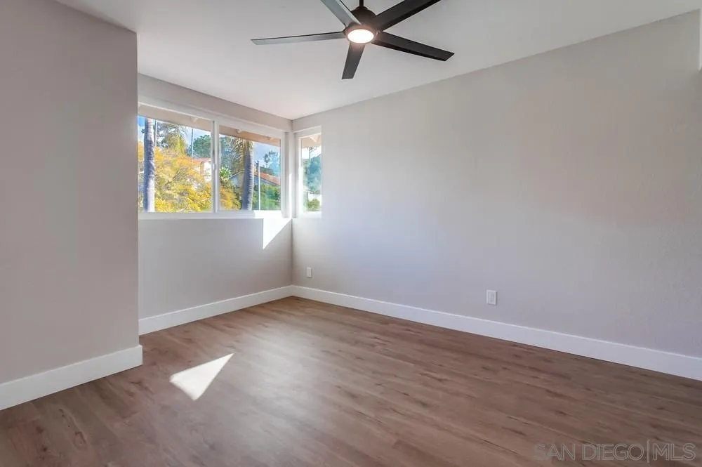 1278 Avenida Miguel Encinitas, CA 92024 - Photo 38 of 47 an empty room with wooden floor and windows
