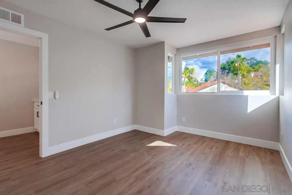 1278 Avenida Miguel Encinitas, CA 92024 - Photo 39 of 47 a view of an empty room with wooden floor and a window