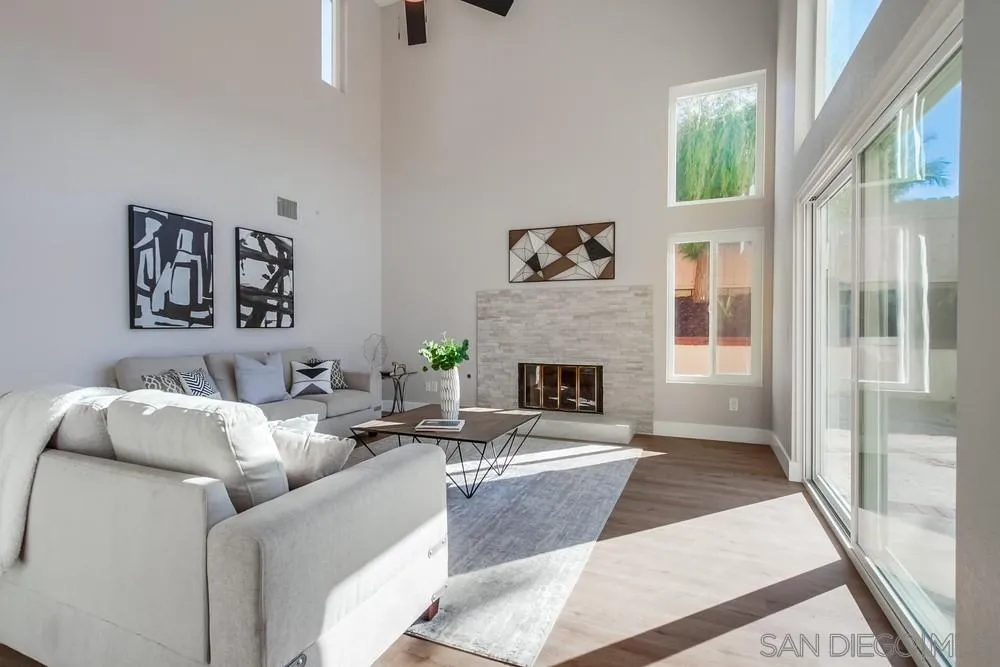 1278 Avenida Miguel Encinitas, CA 92024 - Photo 7 of 47 a living room with furniture a fireplace and a large window