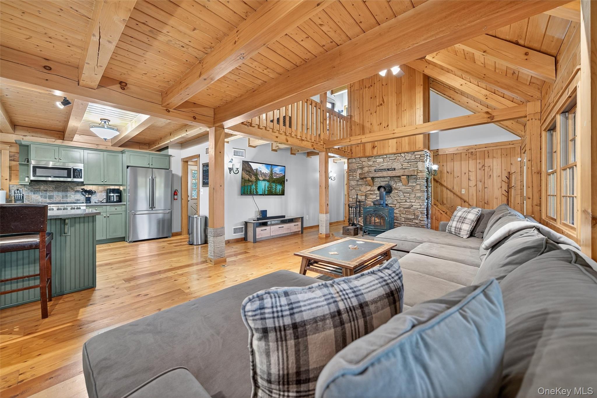 165 Cascade Road Warwick, NY 10990 - Photo 16 of 49 a living room with furniture a fireplace and wooden floor