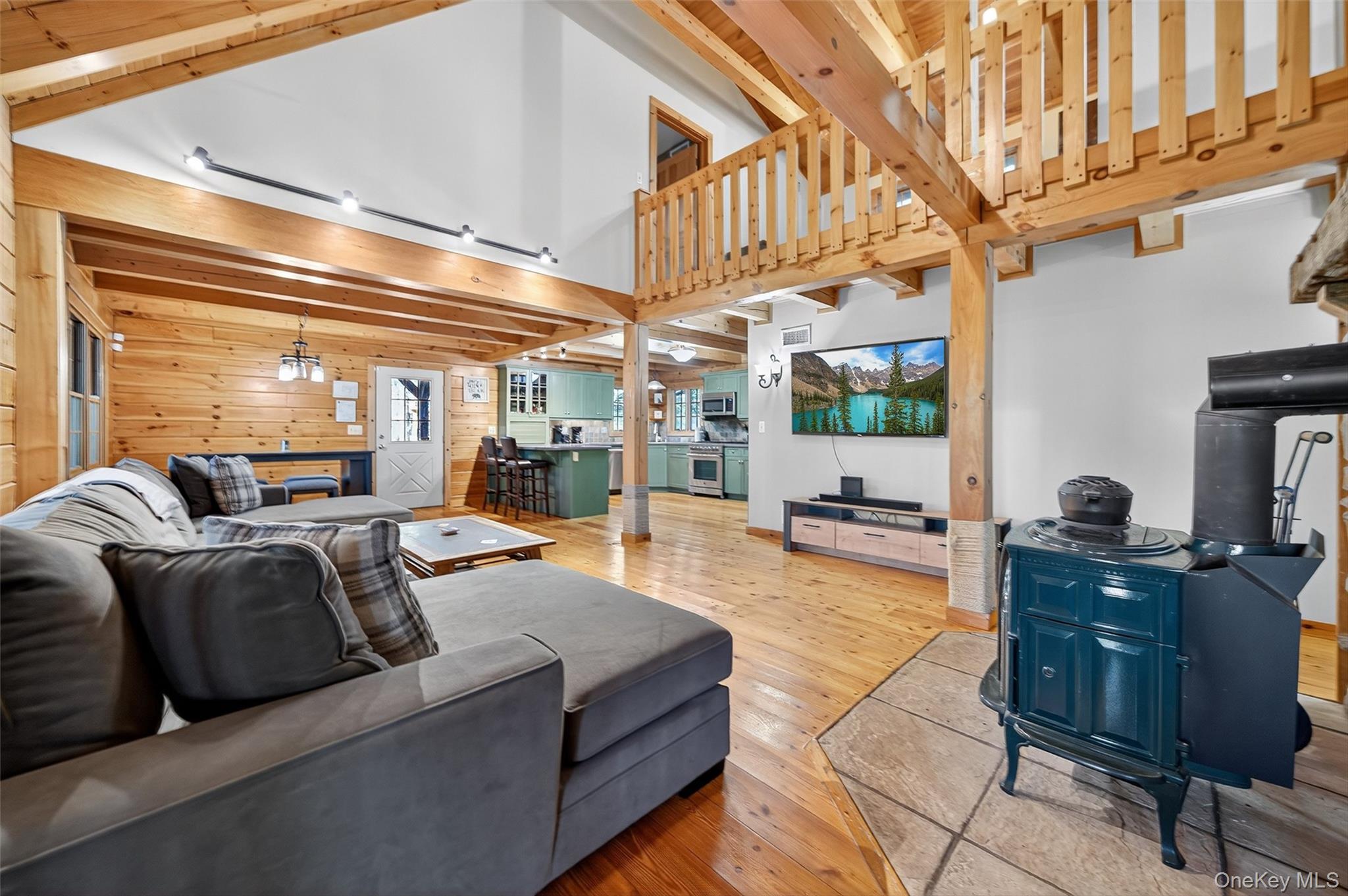 165 Cascade Road Warwick, NY 10990 - Photo 17 of 49 a living room with furniture a fireplace and a large window