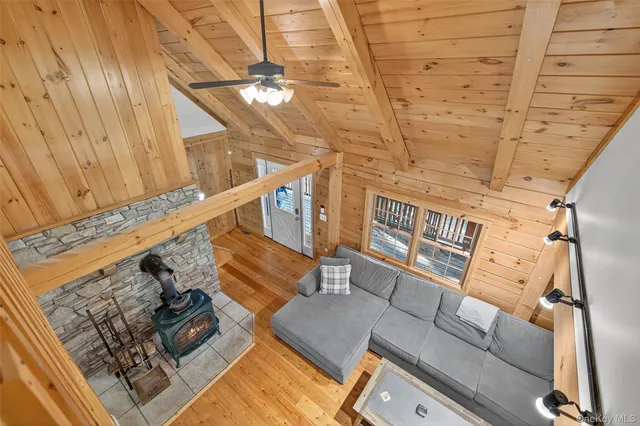 a bedroom with furniture and wooden floor