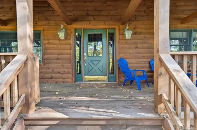 a view of front door of house with stairs