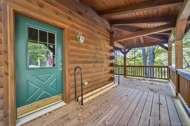 a view of a balcony with wooden floor
