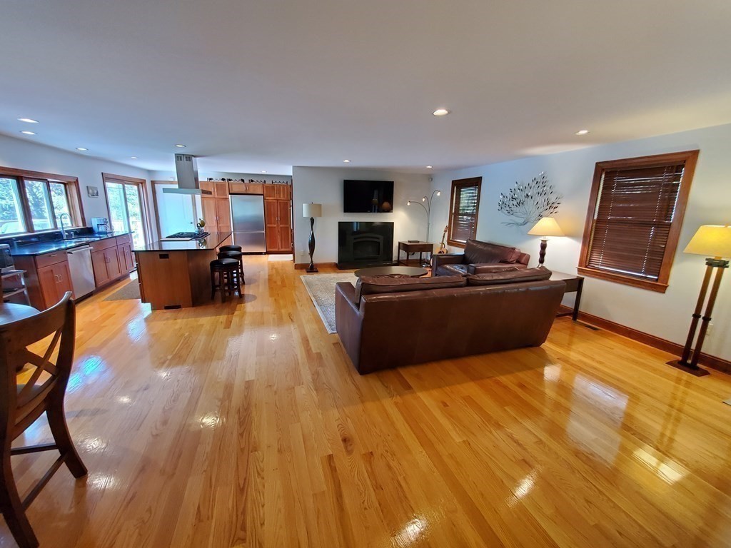 12 Beaman Road Sterling, MA 01564 - Photo 15 of 40 a living room with furniture and a flat screen tv