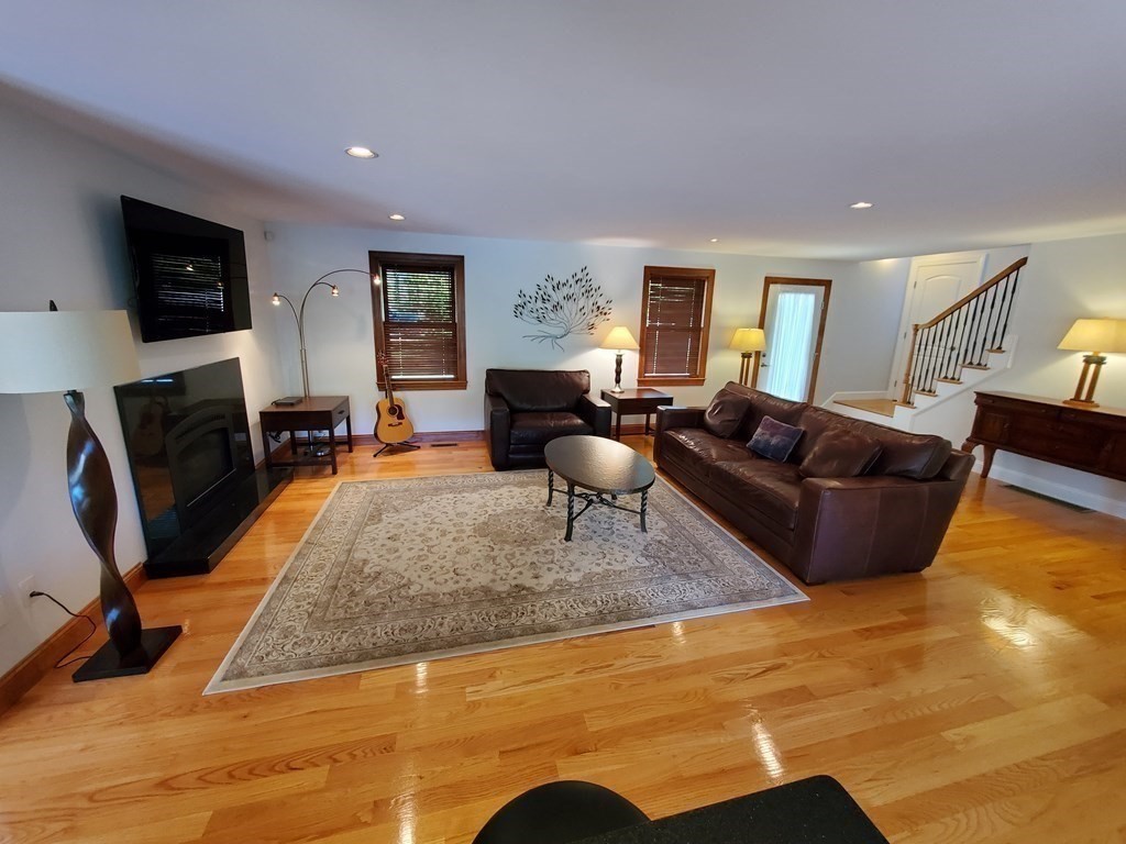 12 Beaman Road Sterling, MA 01564 - Photo 17 of 40 a living room with fireplace furniture and a flat screen tv