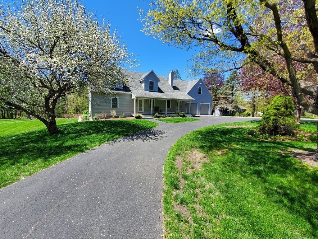 12 Beaman Road Sterling, MA 01564 - Photo 2 of 40 a front view of a house with yard and green space
