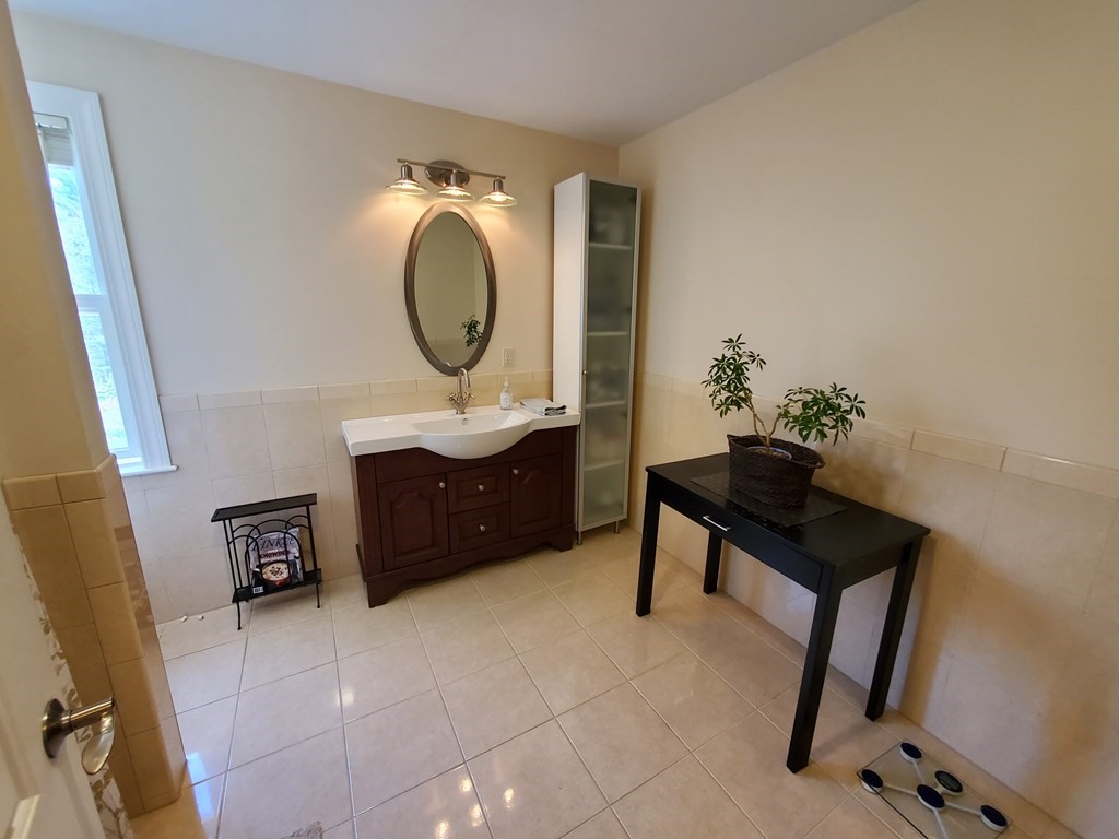 12 Beaman Road Sterling, MA 01564 - Photo 24 of 40 a room with furniture and a mirror