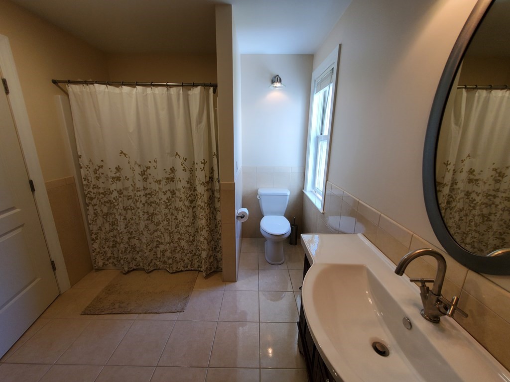 12 Beaman Road Sterling, MA 01564 - Photo 25 of 40 a bathroom with a sink and a mirror