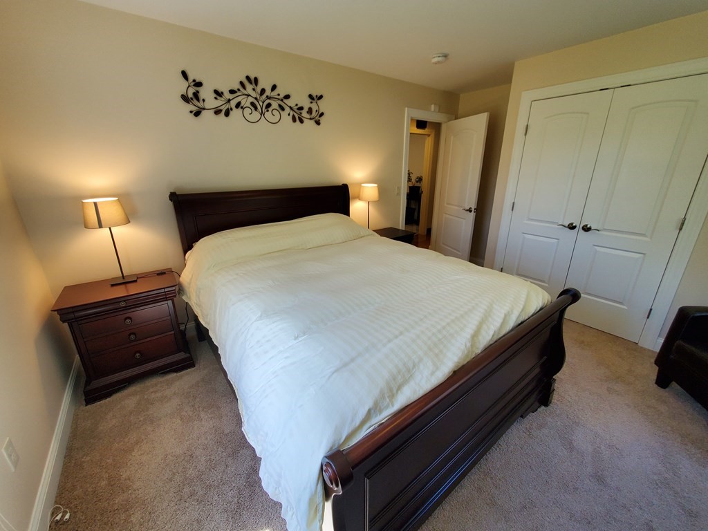 12 Beaman Road Sterling, MA 01564 - Photo 26 of 40 a bedroom with a bed and a mirror