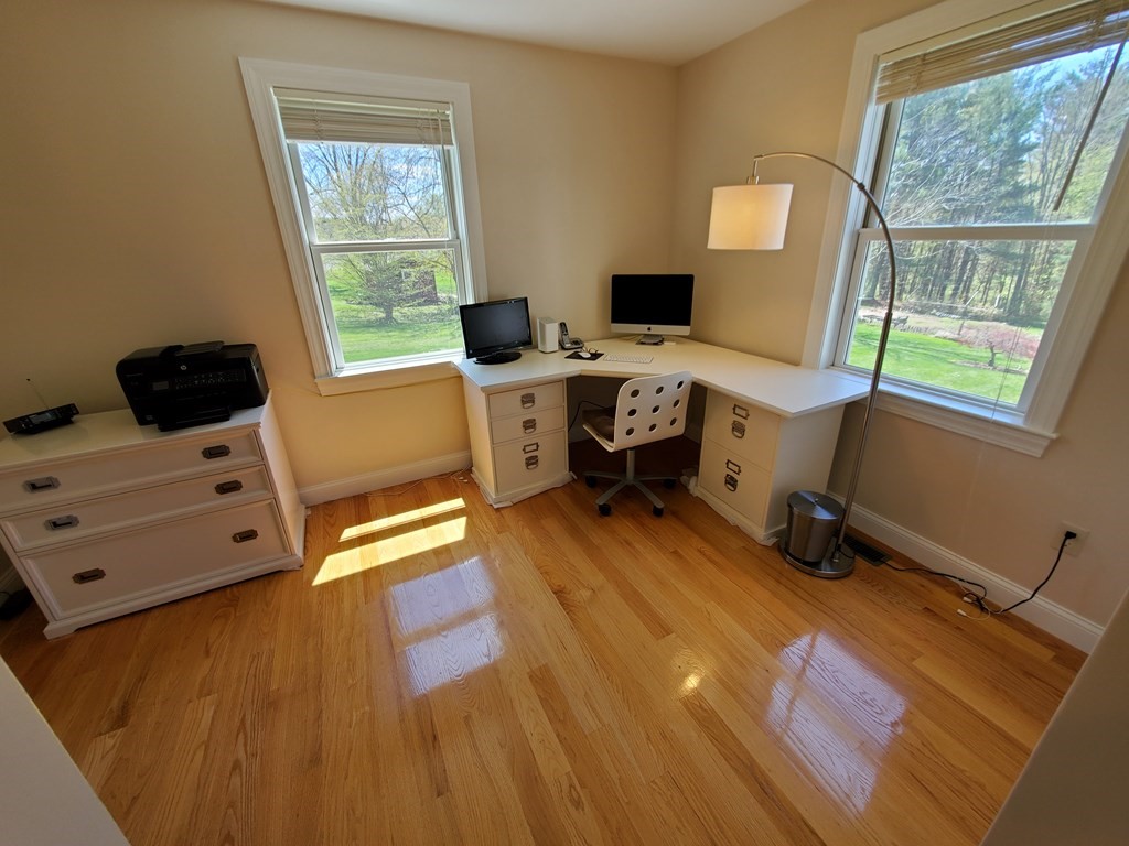 12 Beaman Road Sterling, MA 01564 - Photo 27 of 40 a living room with furniture and a flat screen tv