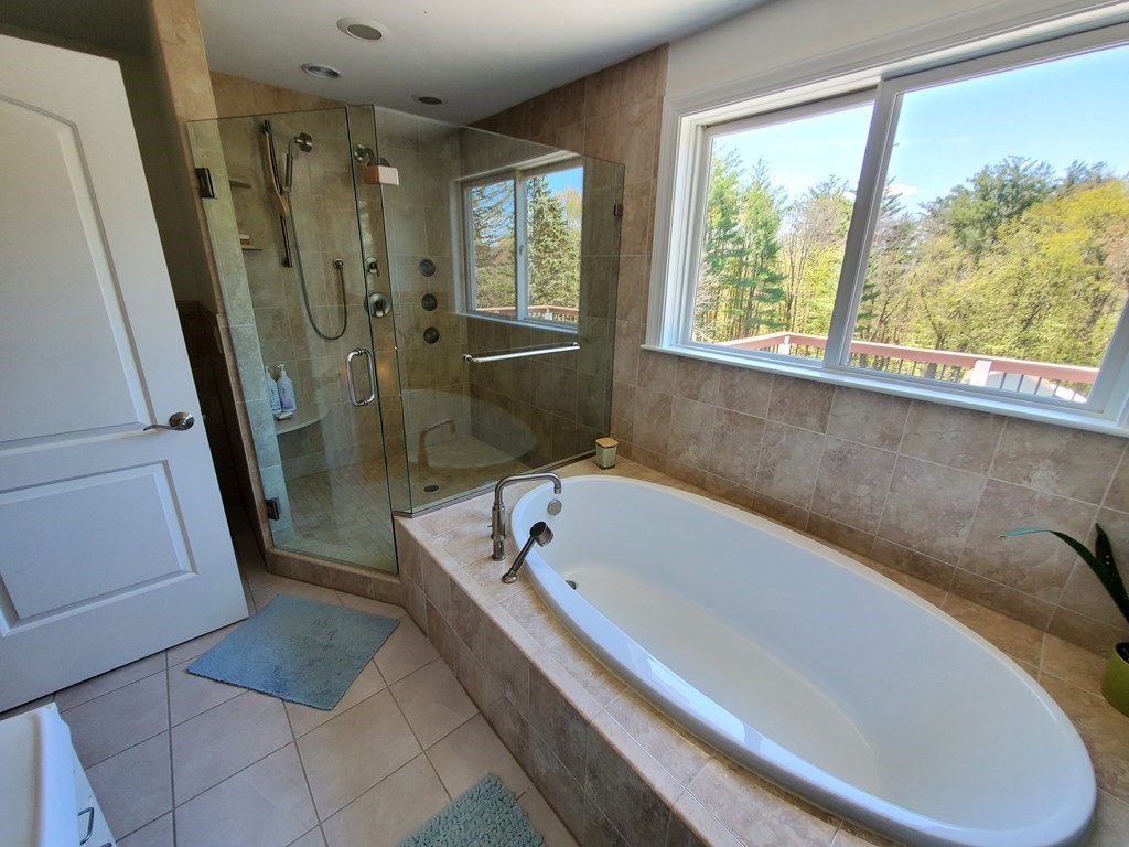 12 Beaman Road Sterling, MA 01564 - Photo 31 of 40 a bathroom with a bathtub a toilet a sink and a shower