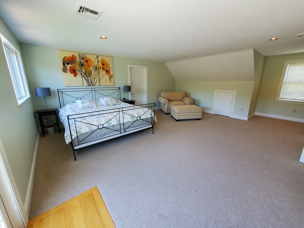 12 Beaman Road Sterling, MA 01564 - Photo 33 of 40 a spacious bedroom with a bed and a couch