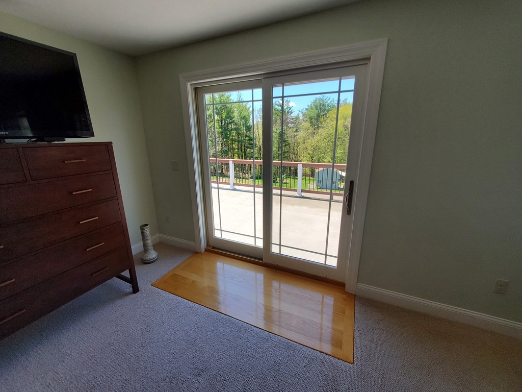 12 Beaman Road Sterling, MA 01564 - Photo 34 of 40 a living room with a flat tv screen and a dresser