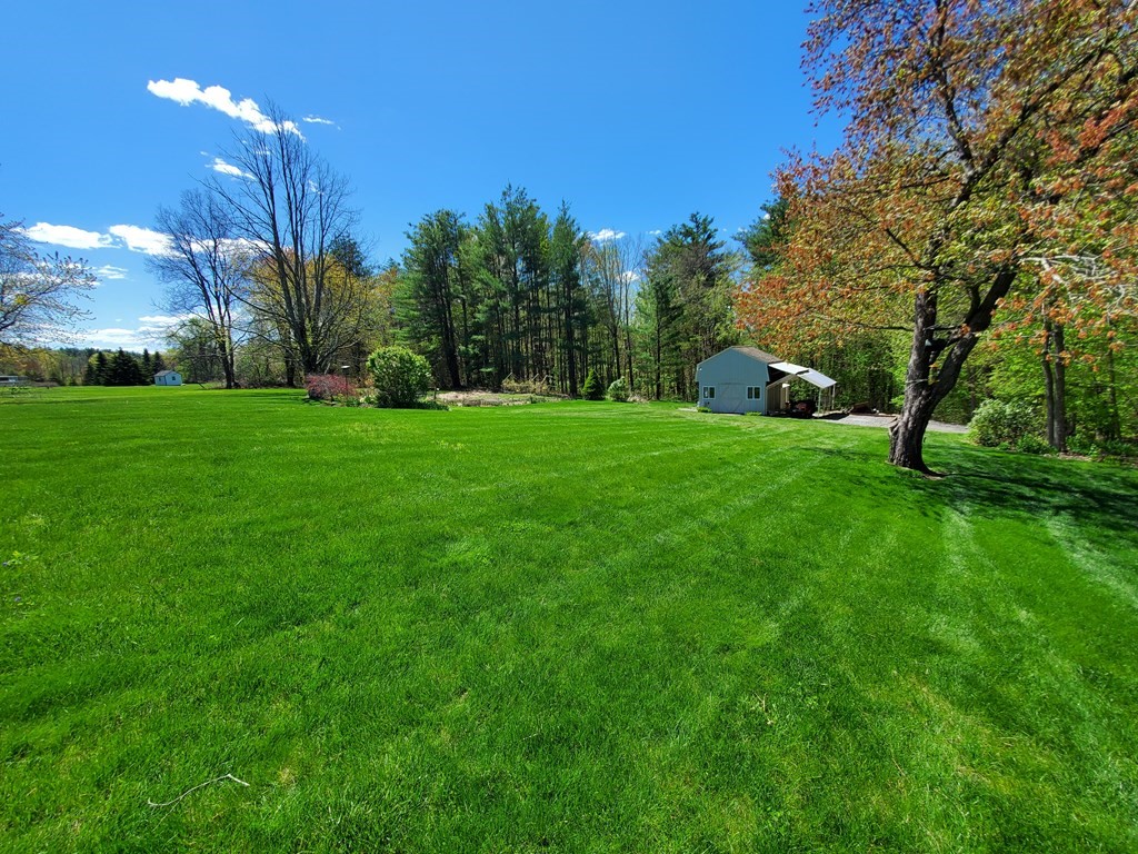 12 Beaman Road Sterling, MA 01564 - Photo 8 of 40 a view of a backyard with large trees