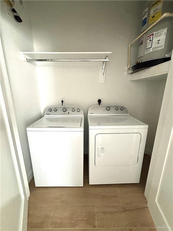 3 Estevan Street Mission, TX 78573 - Photo 16 of 22 Dedicated laundry area featuring a white top-load washing machine and white front-load dryer
