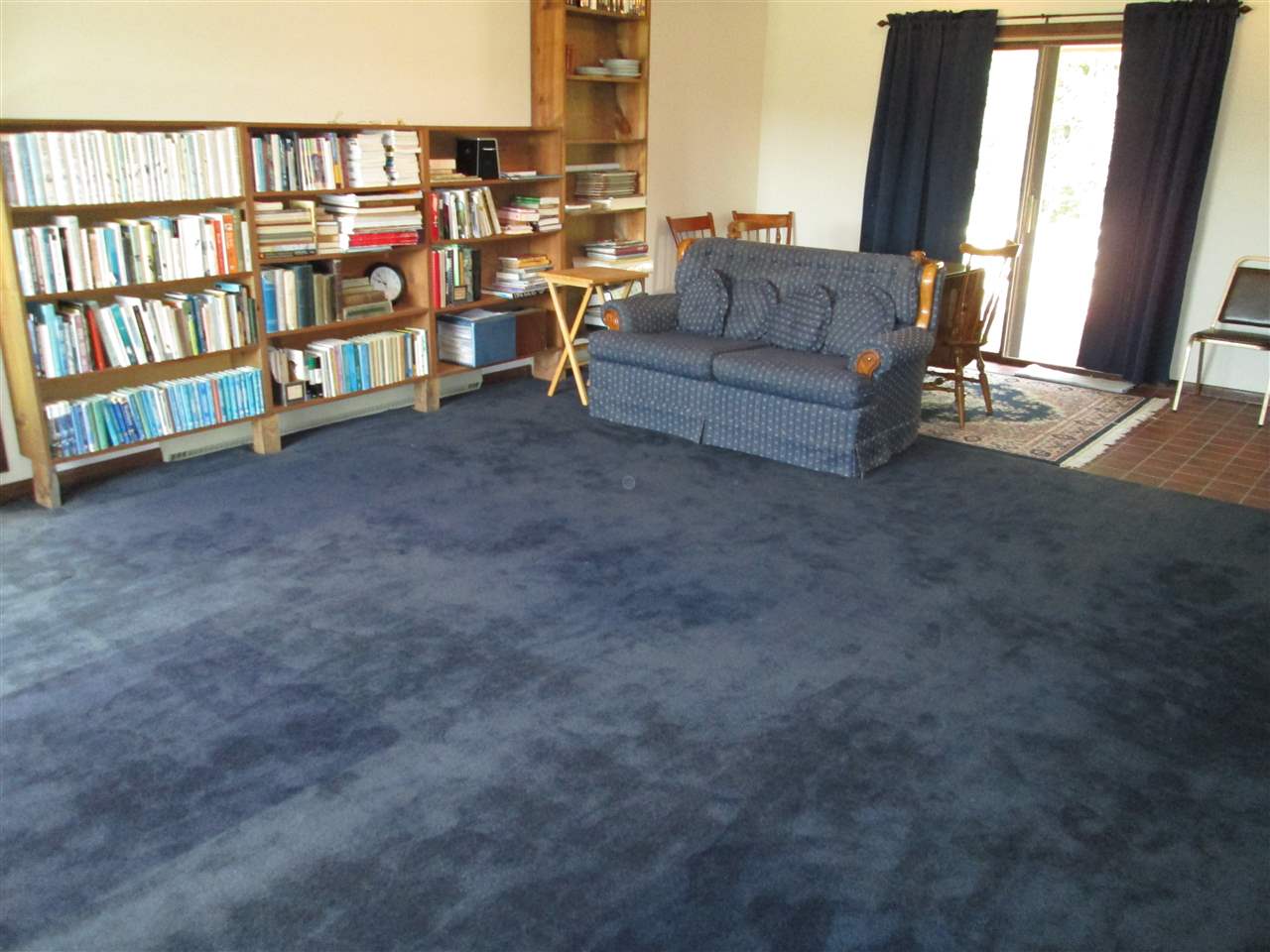 10217 Yale Bridge Road Rockton, IL 61072 - Photo 11 of 25 a living room with furniture and a floor to ceiling window