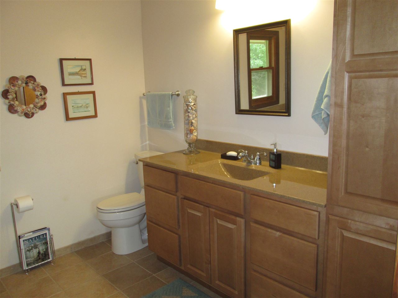 10217 Yale Bridge Road Rockton, IL 61072 - Photo 13 of 25 a bathroom with a toilet sink and mirror