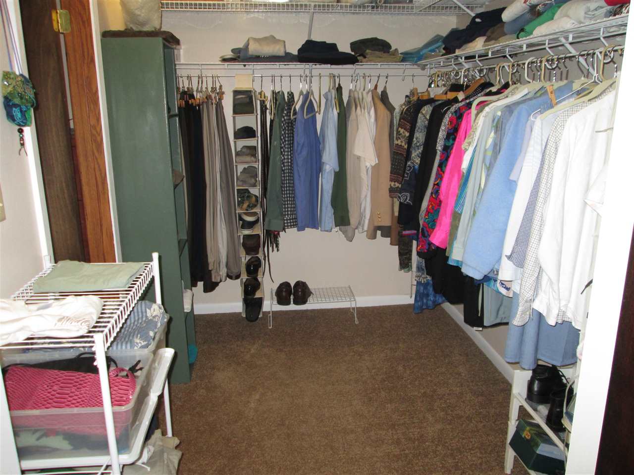 10217 Yale Bridge Road Rockton, IL 61072 - Photo 15 of 25 a view of walk in closet with clothes and shoes