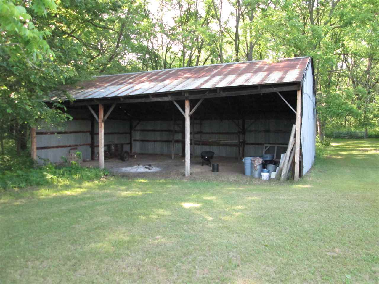 10217 Yale Bridge Road Rockton, IL 61072 - Photo 24 of 25 a view of a wooden house with large trees