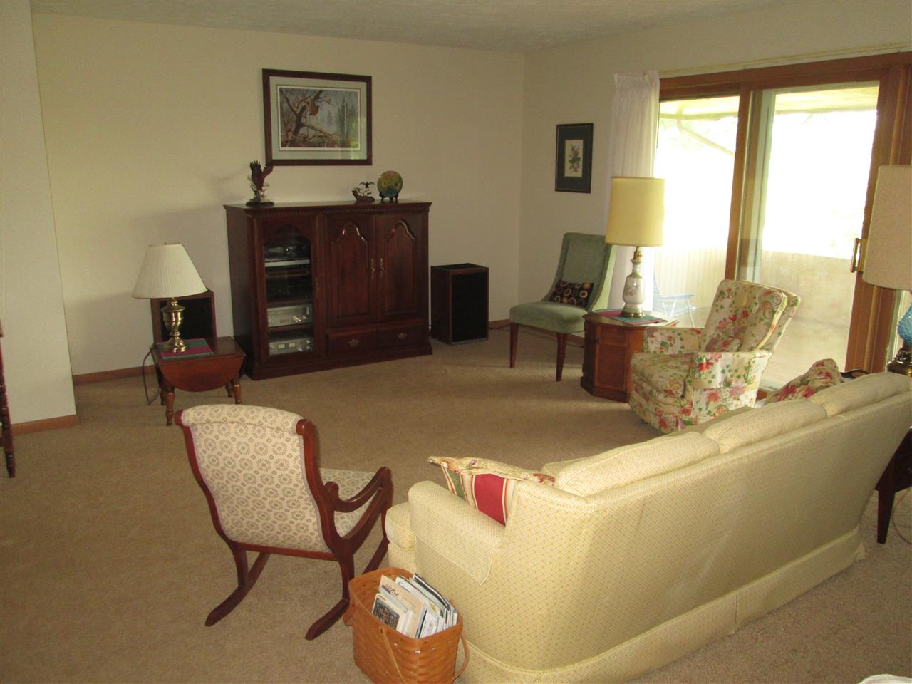 10217 Yale Bridge Road Rockton, IL 61072 - Photo 8 of 25 a living room with furniture and a flat screen tv