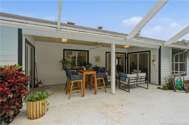 a view of outdoor space with wooden deck and flat screen tv