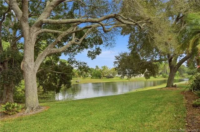 a view of a chair and table in the garden