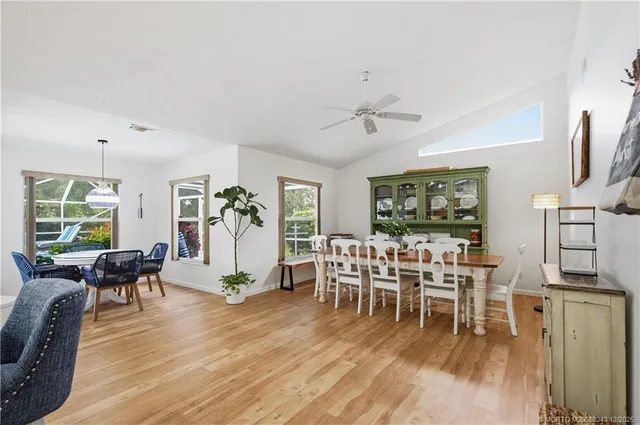 a living room with furniture a wooden floor and a fireplace