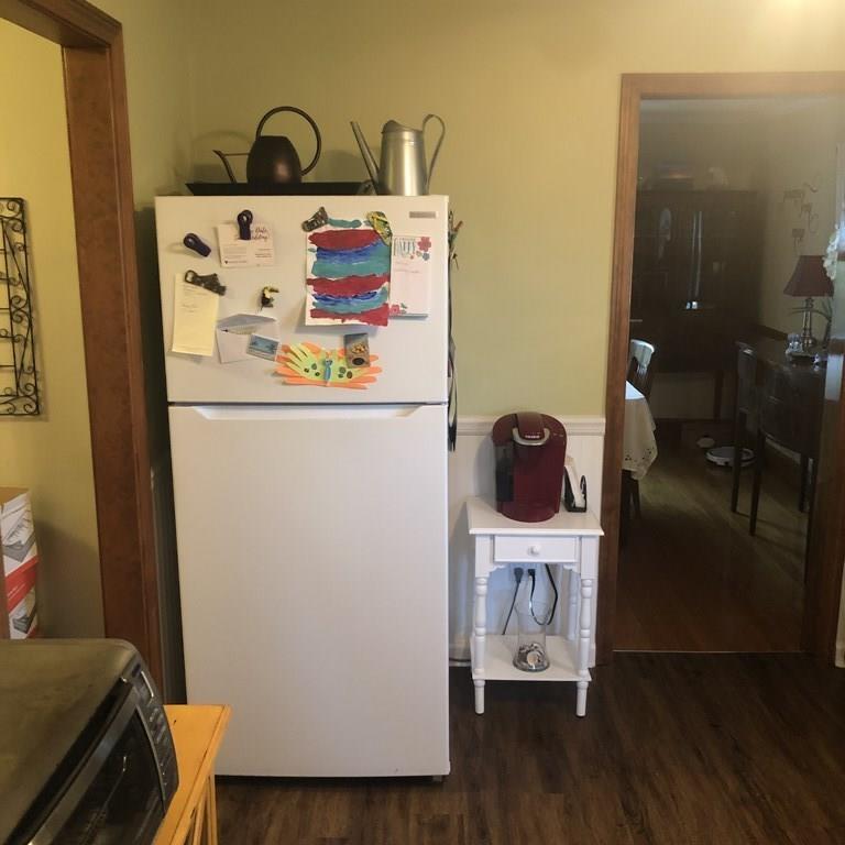 107 Winton Street Springfield, MA 01118 - Photo 13 of 39 a white refrigerator freezer sitting inside of a kitchen