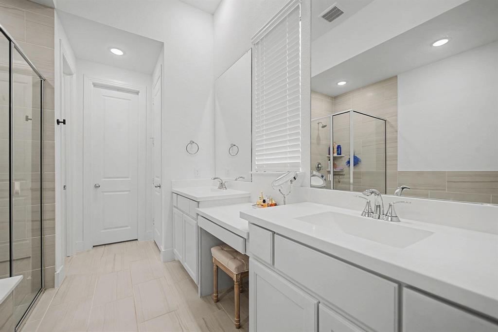 1228 Emilia Road Fate, TX 75087 - Photo 17 of 31 a bathroom with a sink double vanity and a mirror