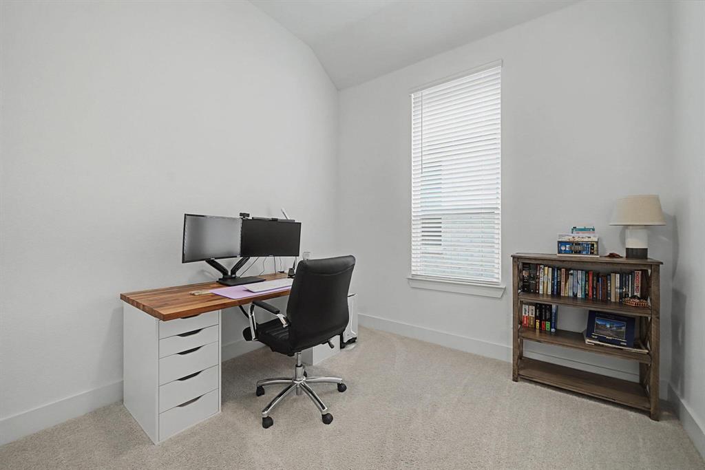 1228 Emilia Road Fate, TX 75087 - Photo 23 of 31 a view of a workspace with furniture and a window