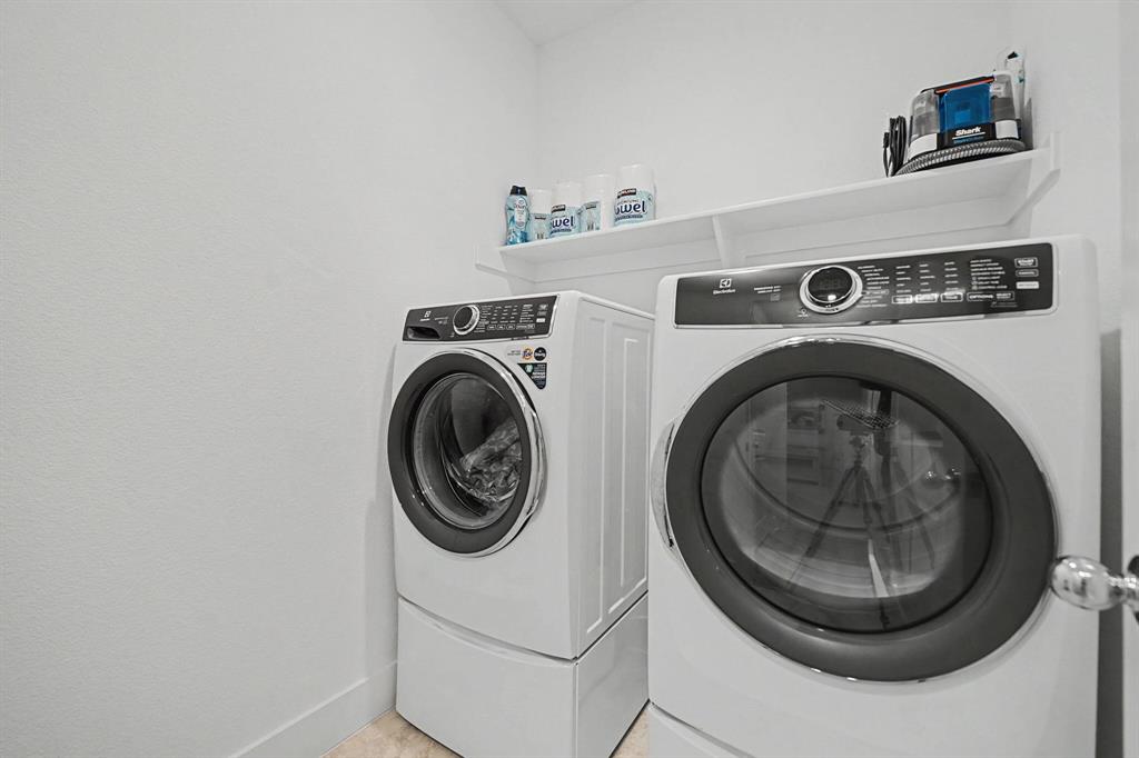 1228 Emilia Road Fate, TX 75087 - Photo 24 of 31 a utility room with dryer and washer