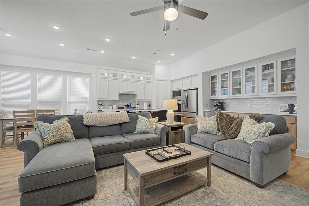 1228 Emilia Road Fate, TX 75087 - Photo 5 of 31 a living room with furniture and a table