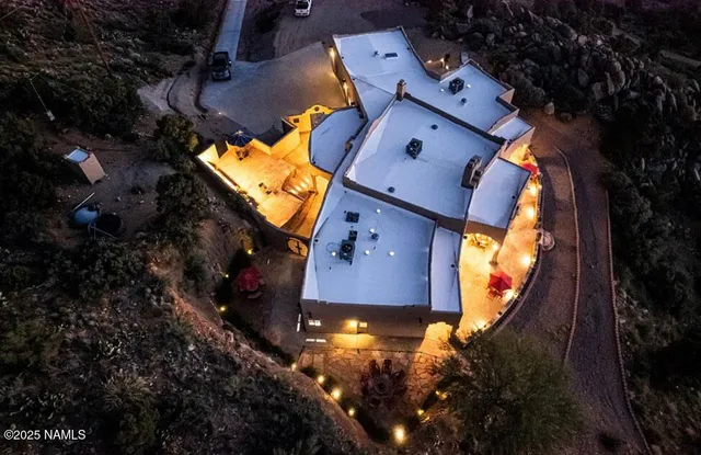 an aerial view of house with swimming pool