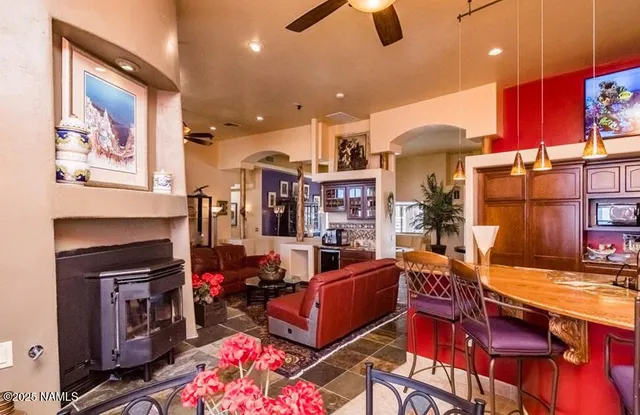 a living room with fireplace furniture and a flat screen tv