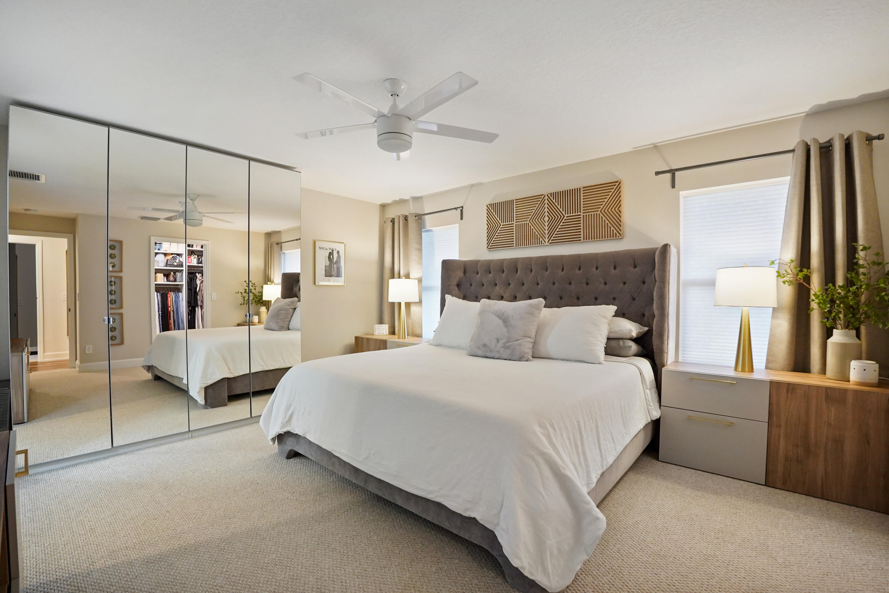 3914 La Rambla Greenacres, FL 33467 - Photo 33 of 43 a spacious bedroom with a bed and a chandelier