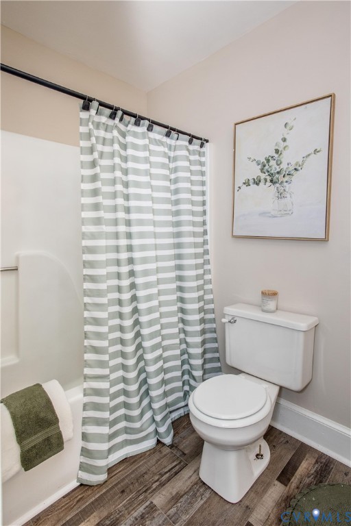 13110 Hensley Road Midlothian, VA 23112 - Photo 18 of 24 a white toilet sitting next to a shower curtain